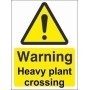 Warning heavy plant crossing sign with yellow background and black symbol
