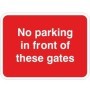 No parking in front of these gates traffic sign with bold white text on red background